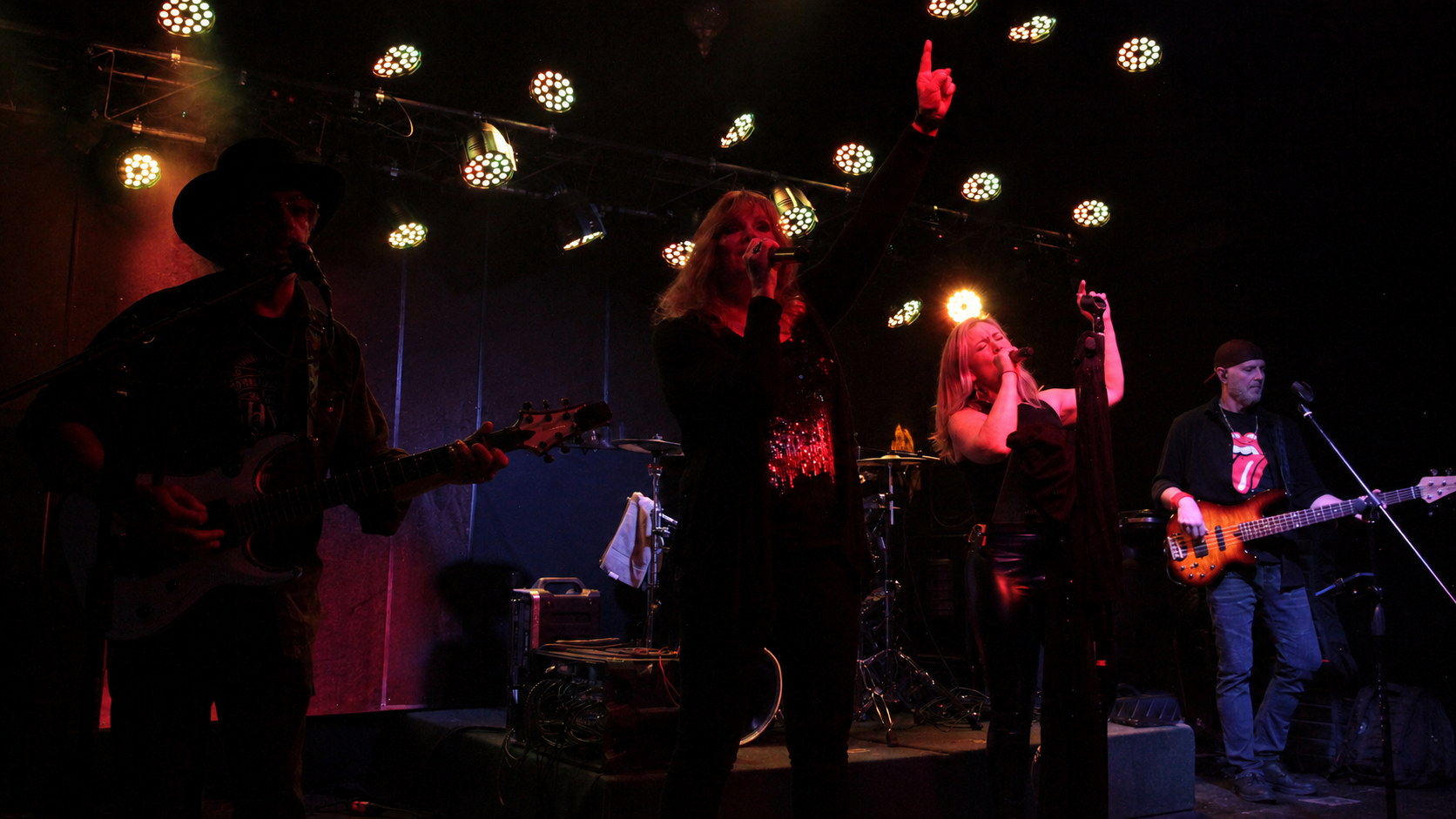 Drama Queen in a full-band stage performance