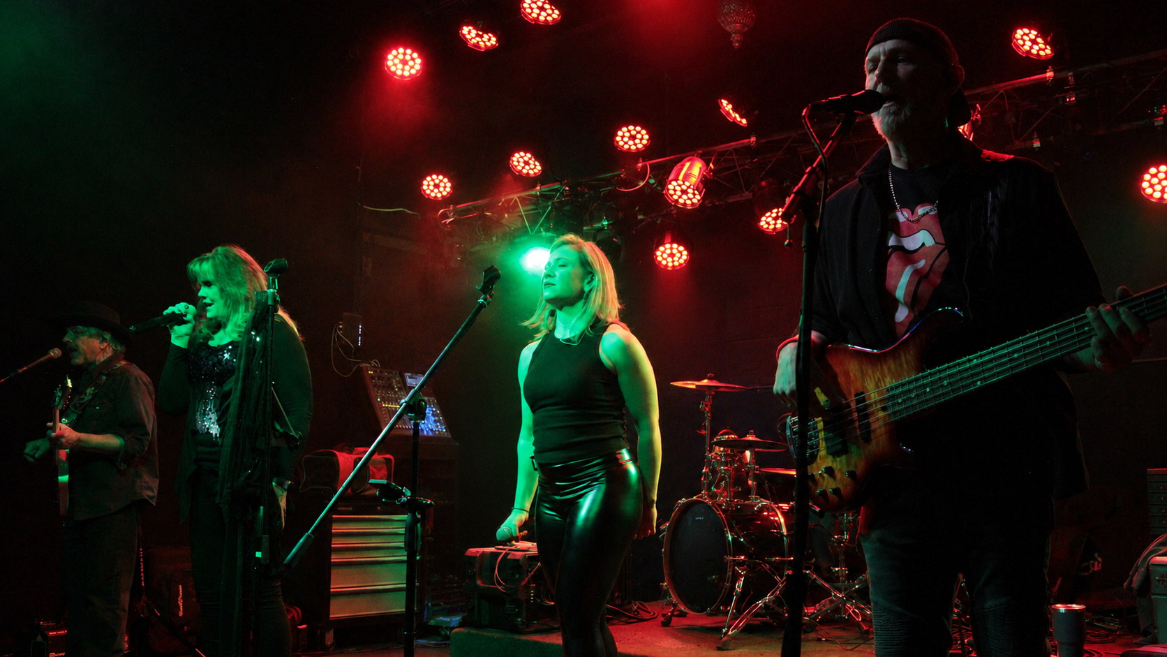 Drama Queen performing together on stage