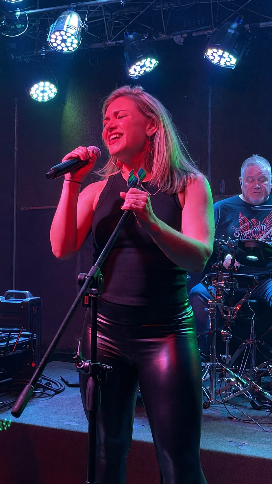 Christa singing on stage