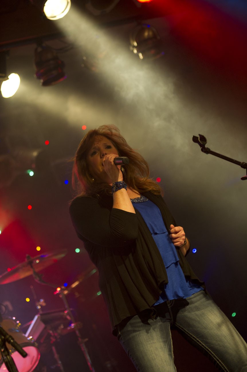 Joan singing on stage
