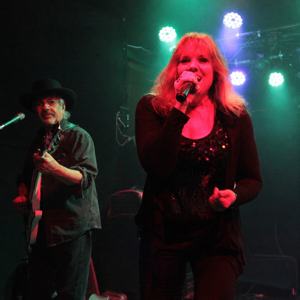 Joan singing with Ted on guitar