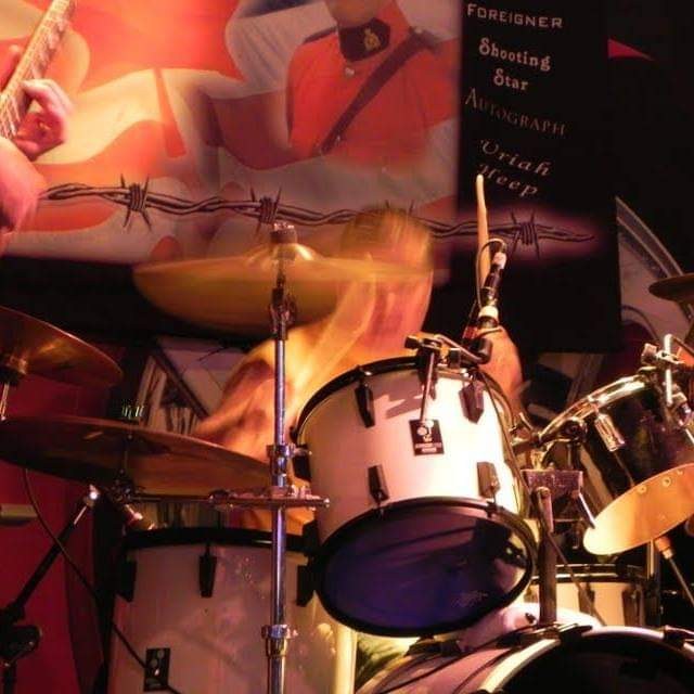 Mark performing on drums